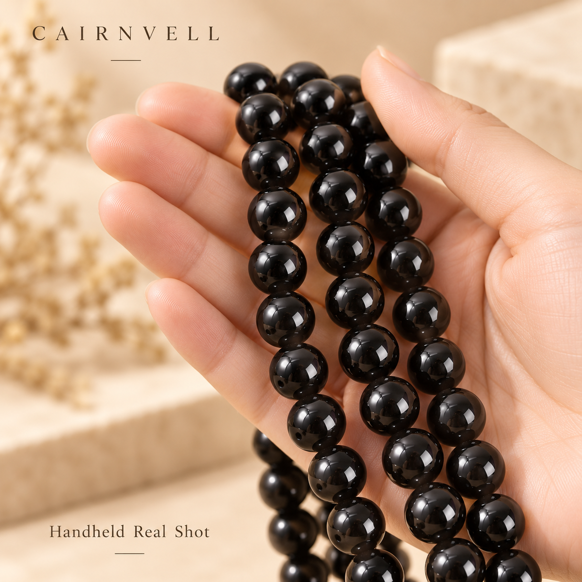 Black obsidian bead strands handheld product view