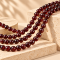 Natural garnet round beads supplier grade 5A, styled product image