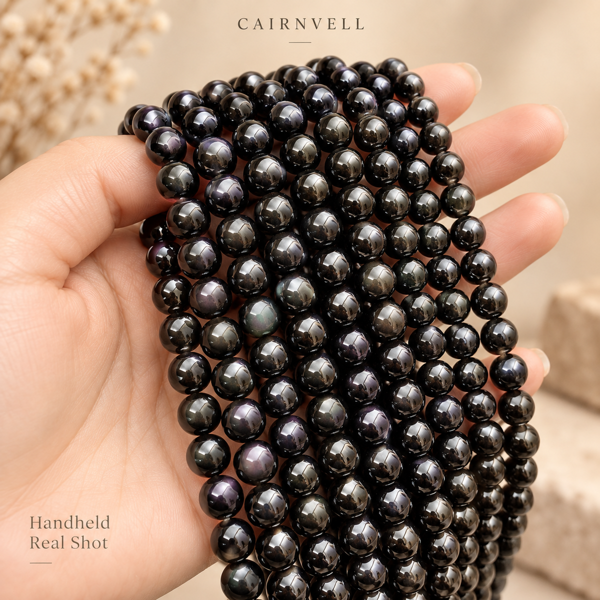 Single-eye black obsidian 5A bead strands handheld product view